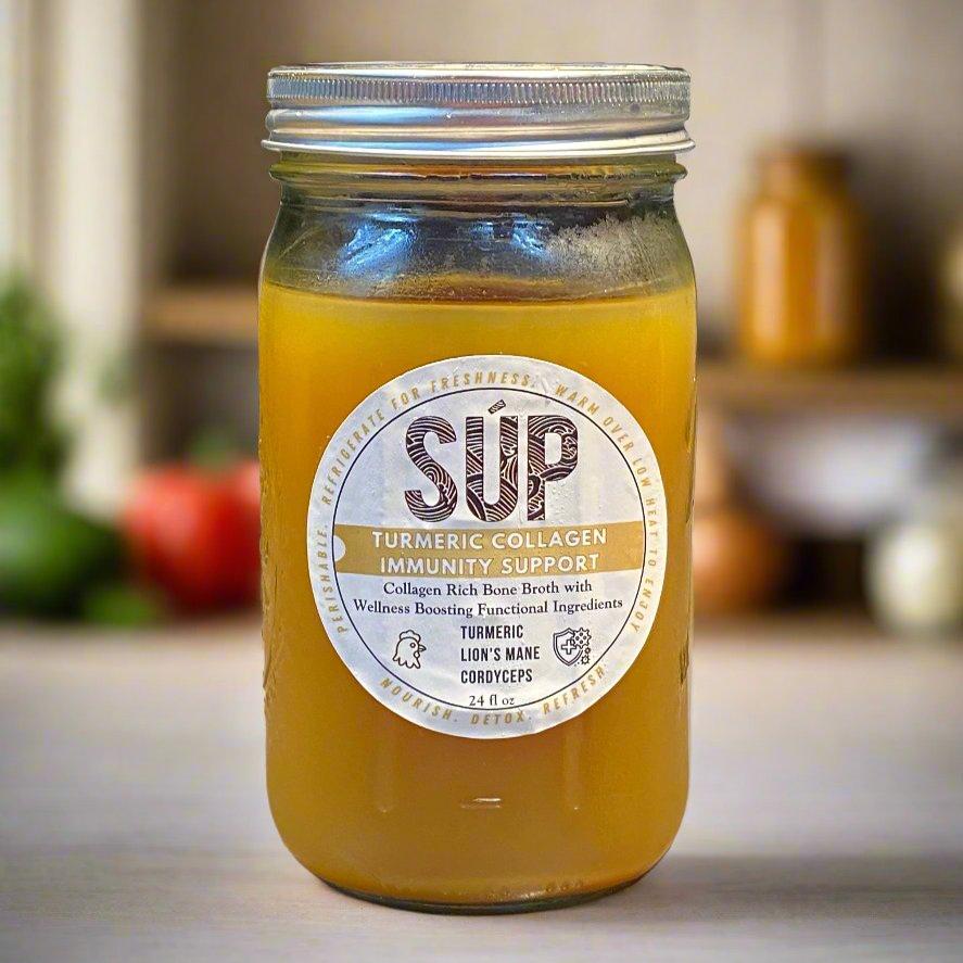 Jar of Súp Wellness Turmeric Collagen Immunity bone broth with golden turmeric root
